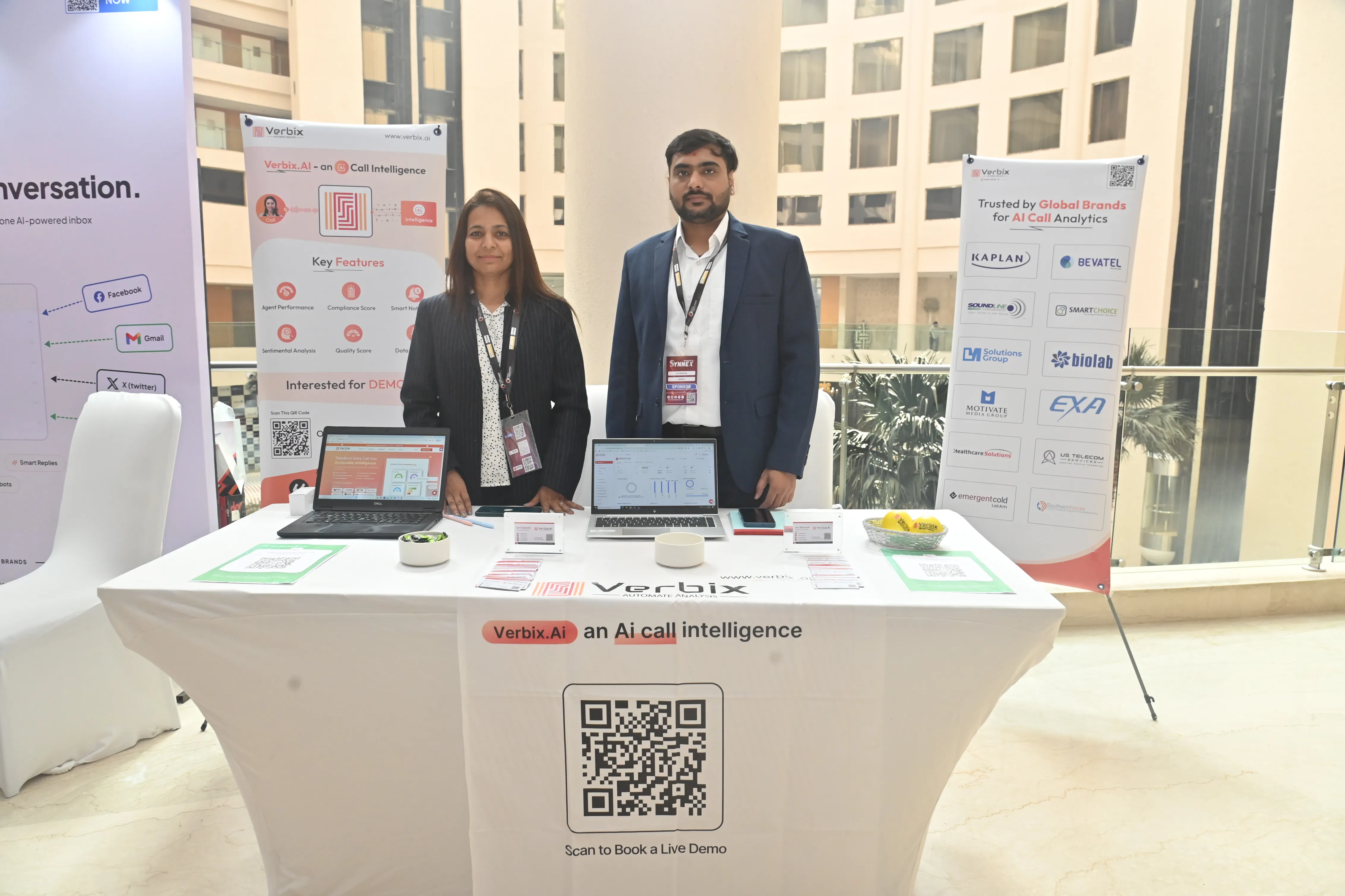 Verbix AI exhibition booth team interacting with visitors